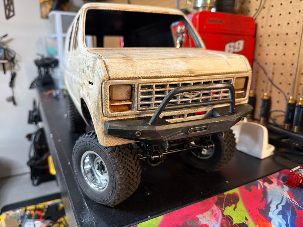 RC crawler taking on a trail obstacle